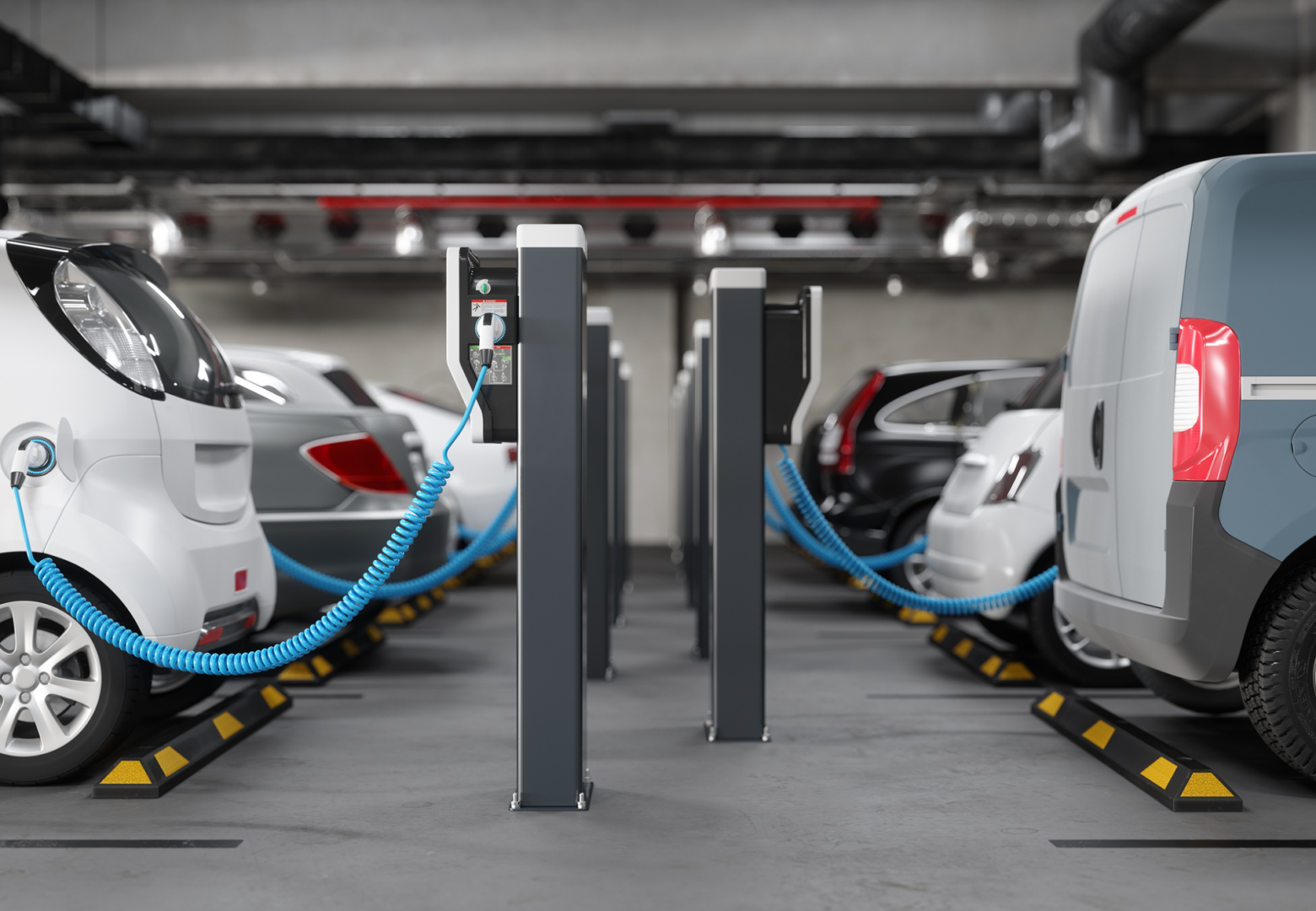 Electric vehicles charging in a parking garage.