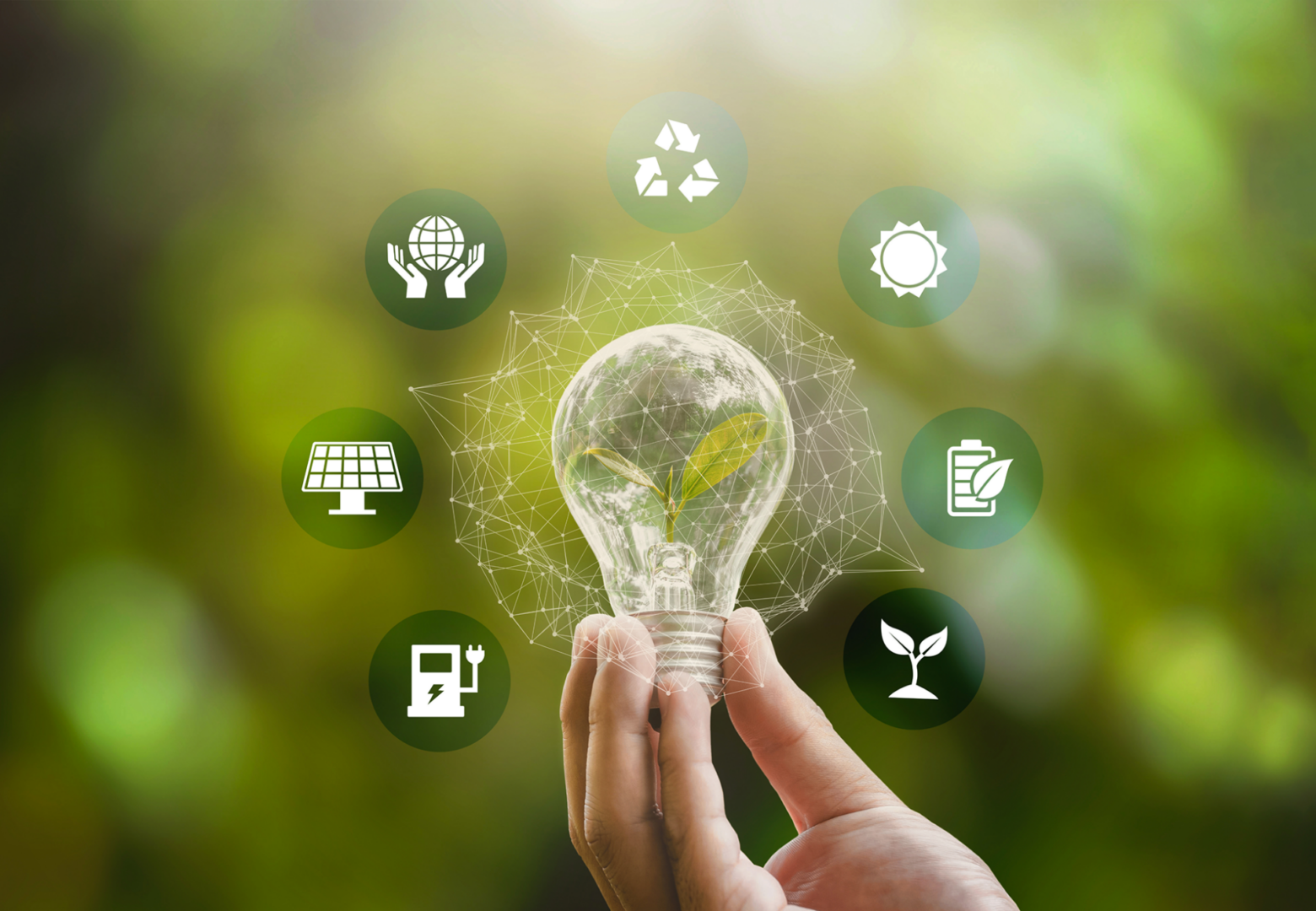 Hand holding light bulb with eco icons.