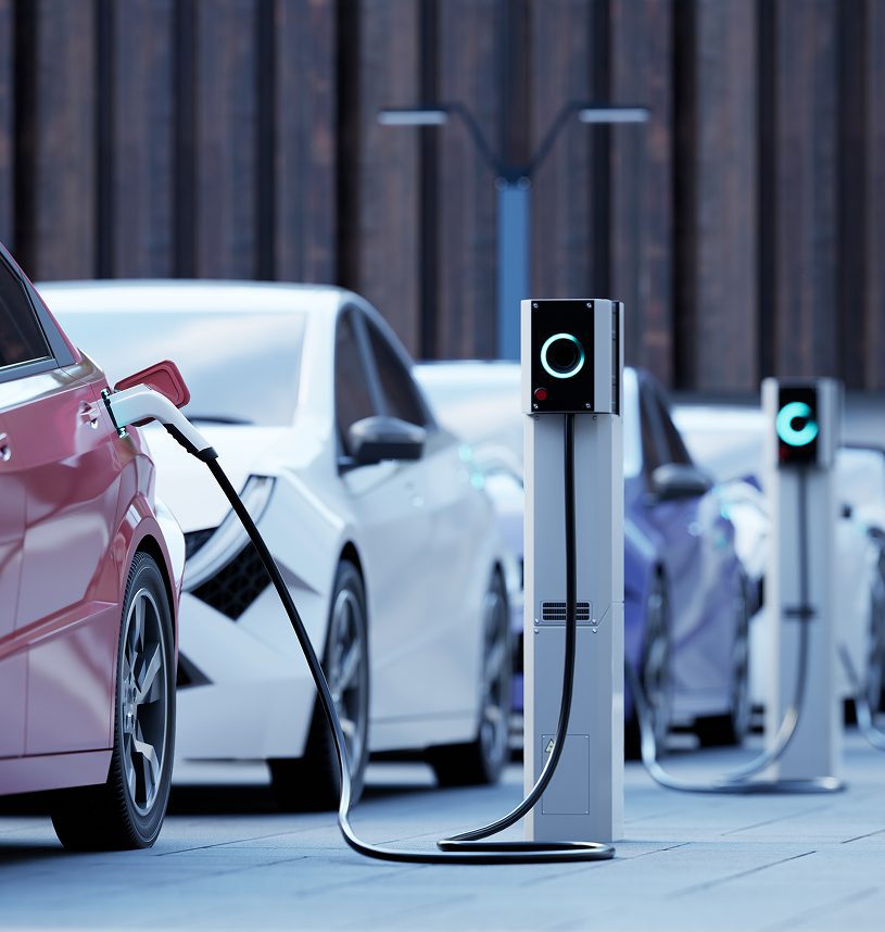 Electric cars charging at a station.