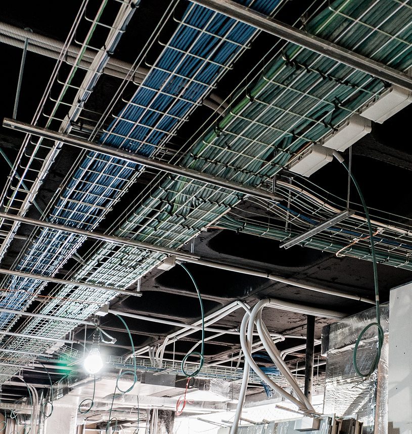 Data center ceiling with network cables.